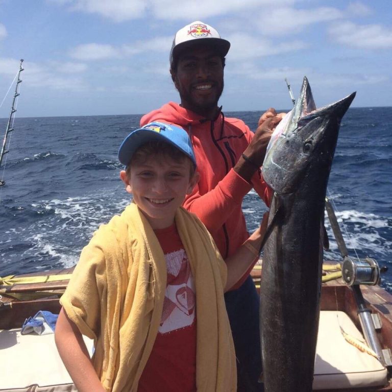 Big game fishing happy boy with fishing holidays and trips Boa Vista