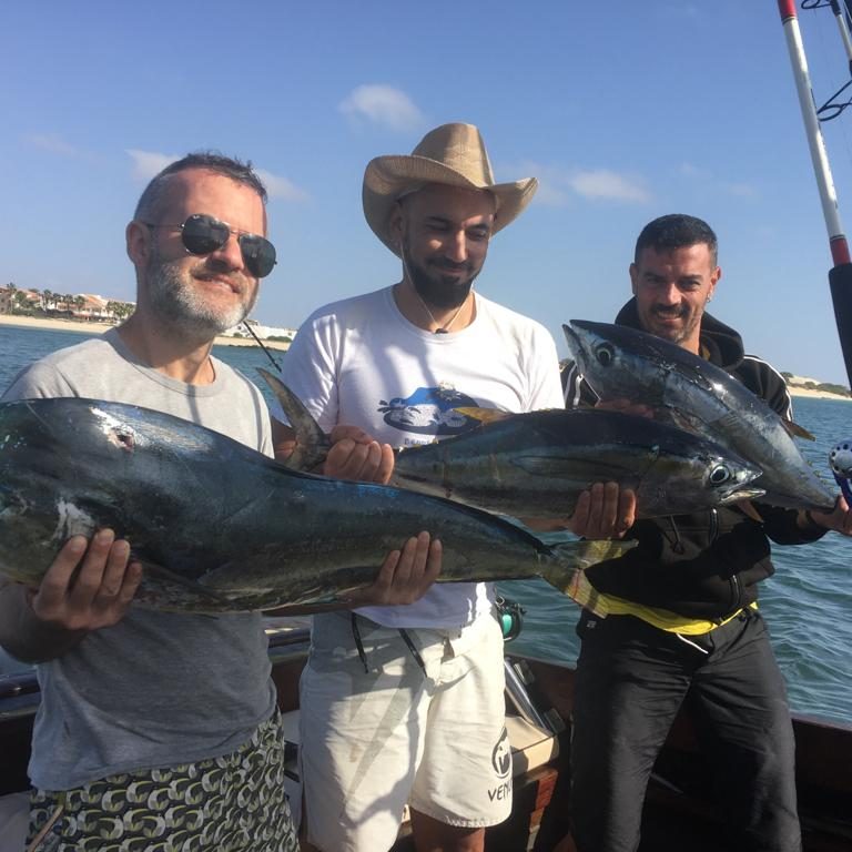 Three men with big game catch boat trips and fishing boa vista